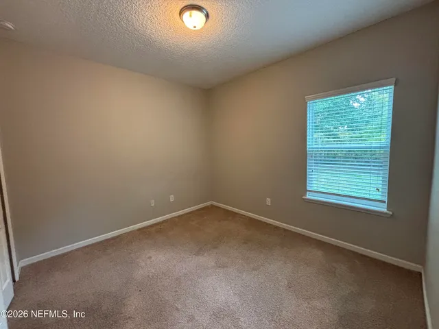 a bathroom with a sink double vanity granite tub toilet and shower