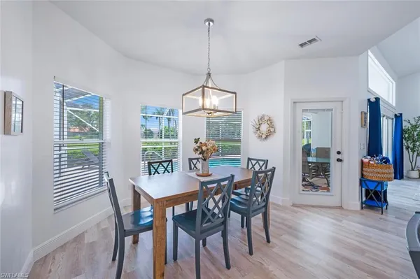 a kitchen with stainless steel appliances a stove a refrigerator and a microwave