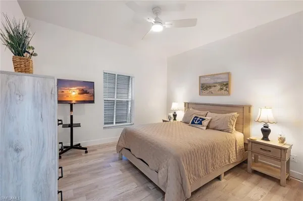 a spacious bathroom with a tub sink and mirror