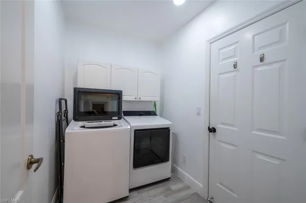 a bathroom with a double vanity sink toilet mirror and shower