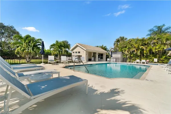 a view of a patio with swimming pool