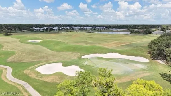 a view of swimming pool with outdoor seating and yard in back