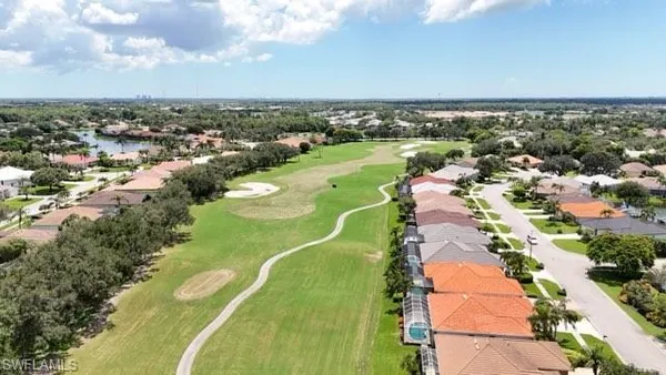 a view of a swimming pool and an outdoor seating