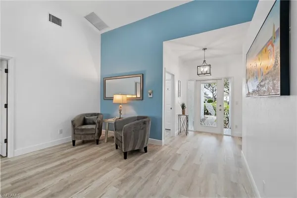 a view of a livingroom with furniture and wooden floor