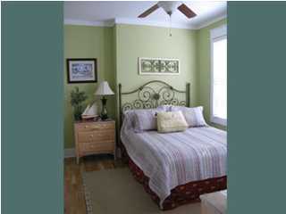 106 Chelsea Loop Road Santa Rosa Beach, FL 32459 - Photo 6 of 14 a bedroom with a bed and a table