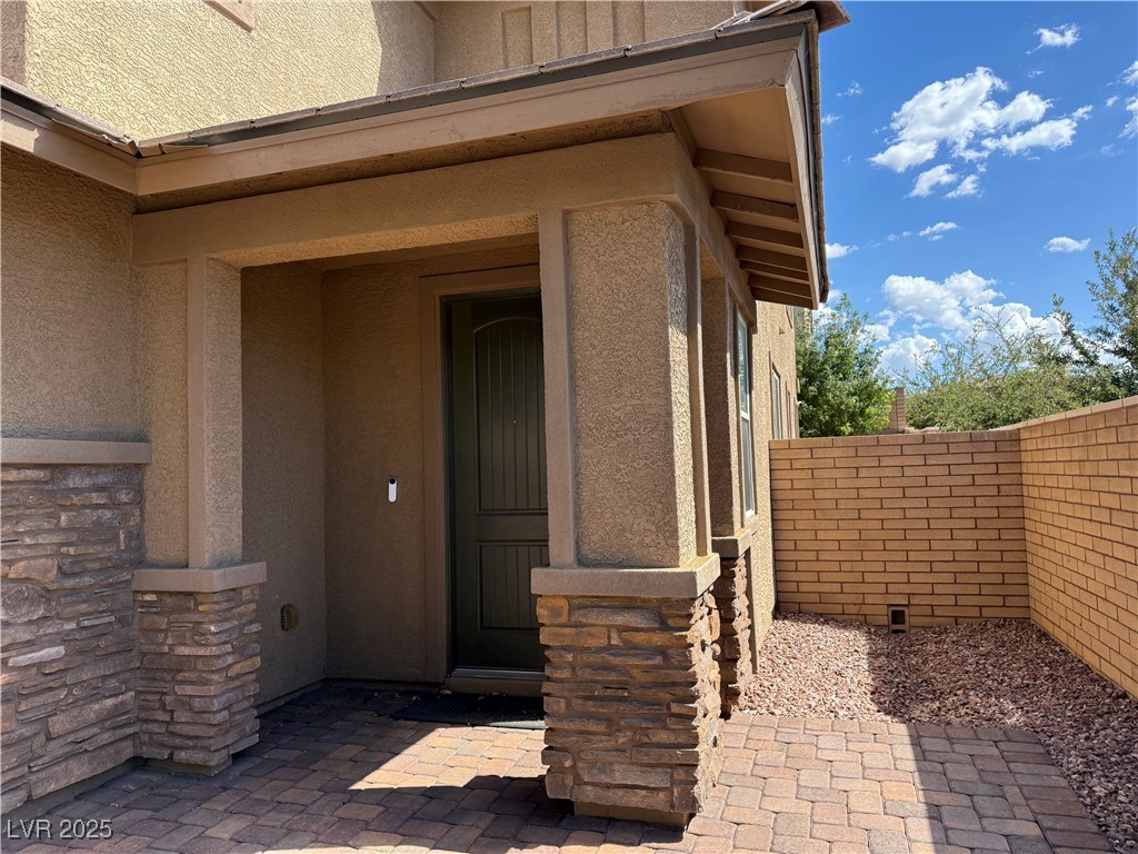 340 Mezzaforte Street Henderson, NV 89011 - Photo 2 of 39 Entrance to property with stucco siding and stone siding