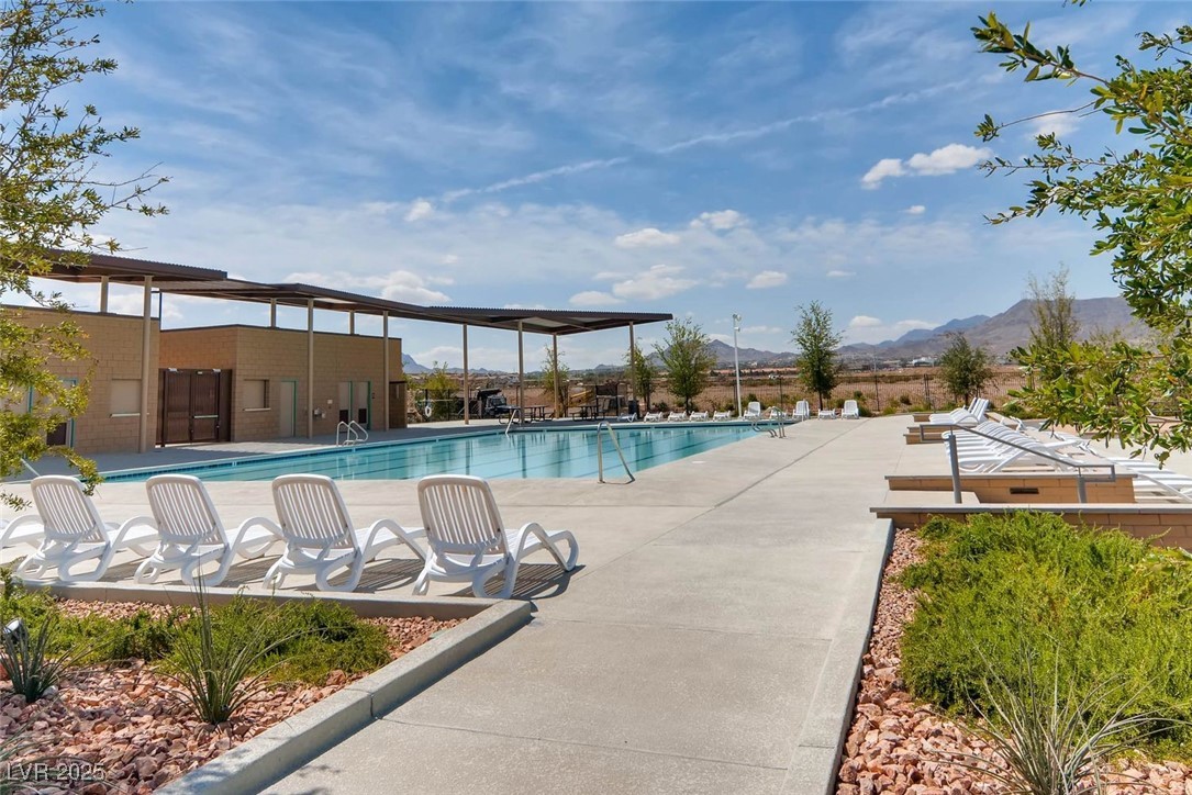 340 Mezzaforte Street Henderson, NV 89011 - Photo 34 of 39 Community pool featuring a patio area and a mountain view