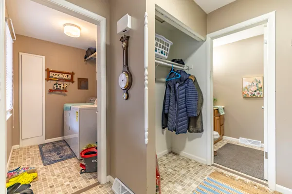 a bathroom with a sink mirror and vanity
