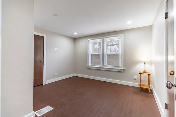 a view of a room with wooden ceiling