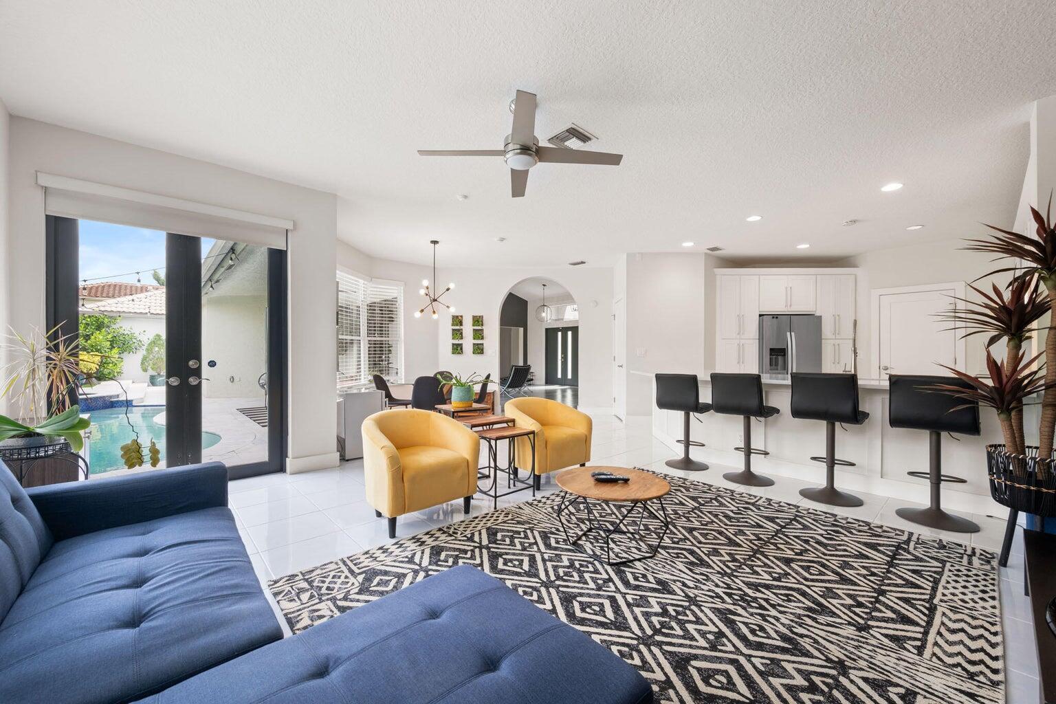 10982 Ravel Court Boca Raton, FL 33498 - Photo 12 of 44 a living room with furniture and a large window