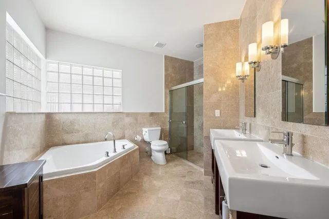 a bathroom with a bathtub and sink