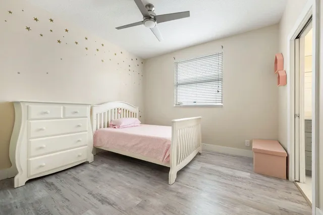 a room with a bed and a window