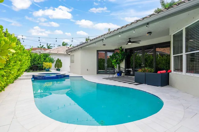 a view of a swimming pool with a patio