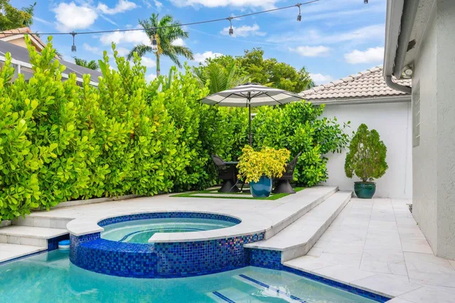 a view of a swimming pool with a patio