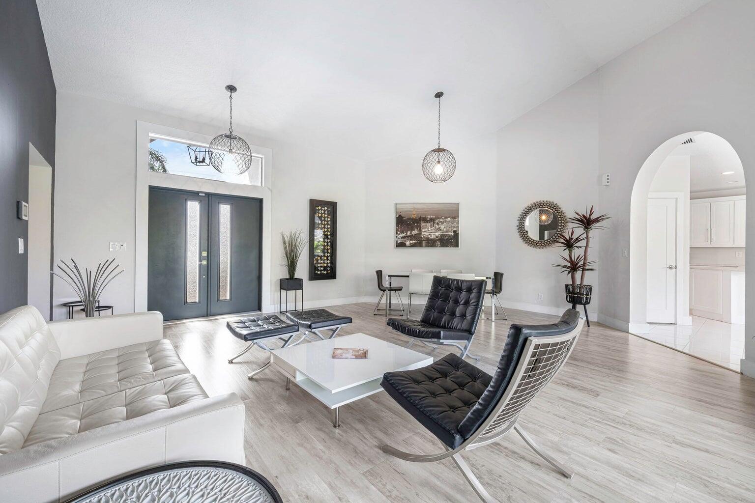 10982 Ravel Court Boca Raton, FL 33498 - Photo 5 of 44 a living room with furniture and wooden floor