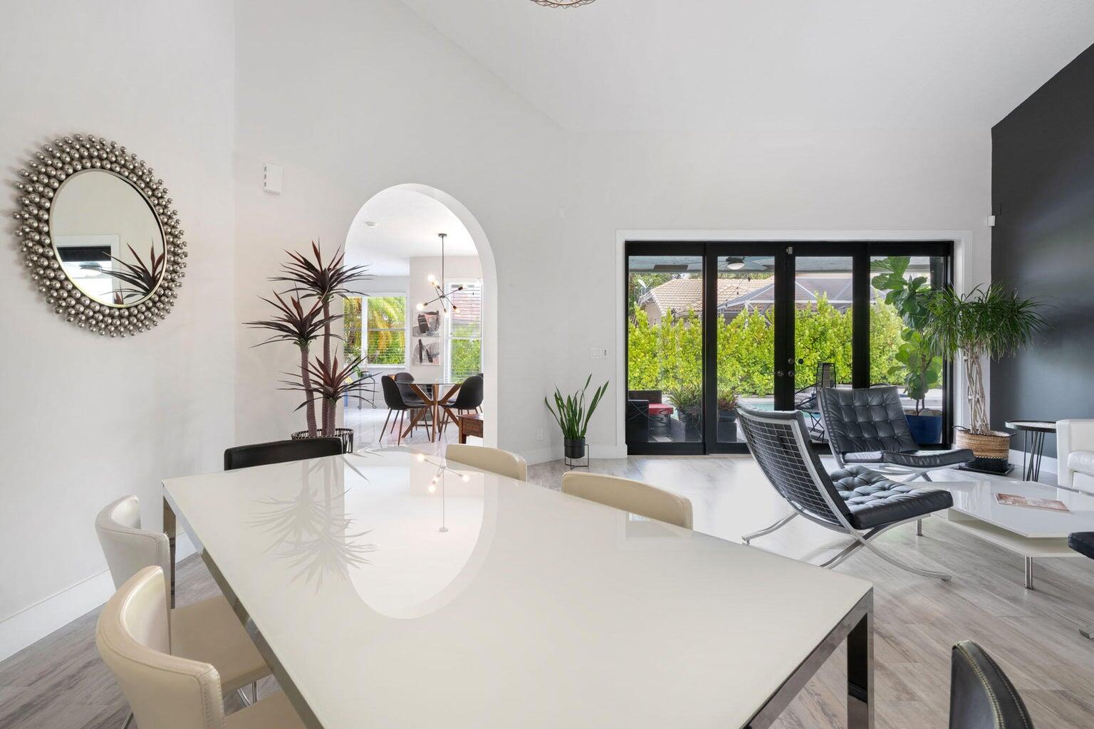 10982 Ravel Court Boca Raton, FL 33498 - Photo 7 of 44 a living room with furniture and a large window