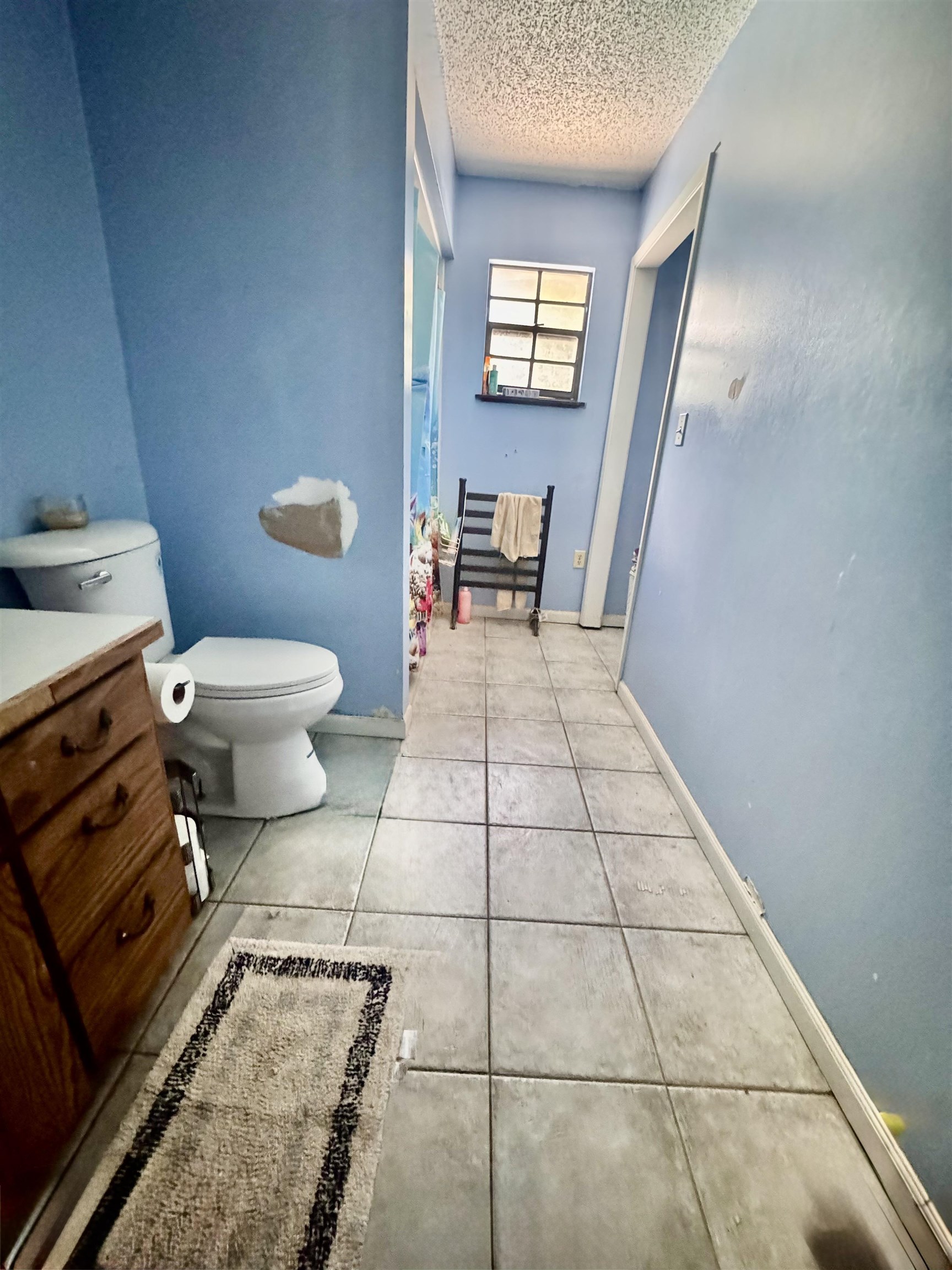 554 Hayley Road St. Augustine, FL 32086 - Photo 24 of 46 a bathroom with a toilet a sink and a mirror