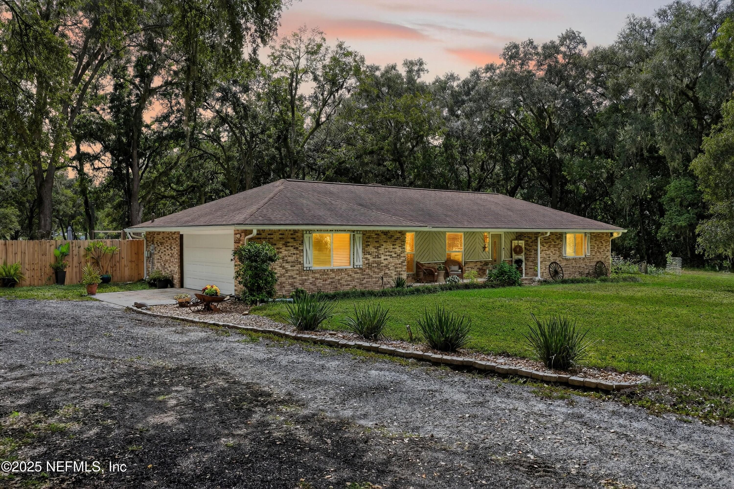 6049 Taylor Road Jacksonville, FL 32234 - Photo 13 of 60 a view of an house with backyard space and garden