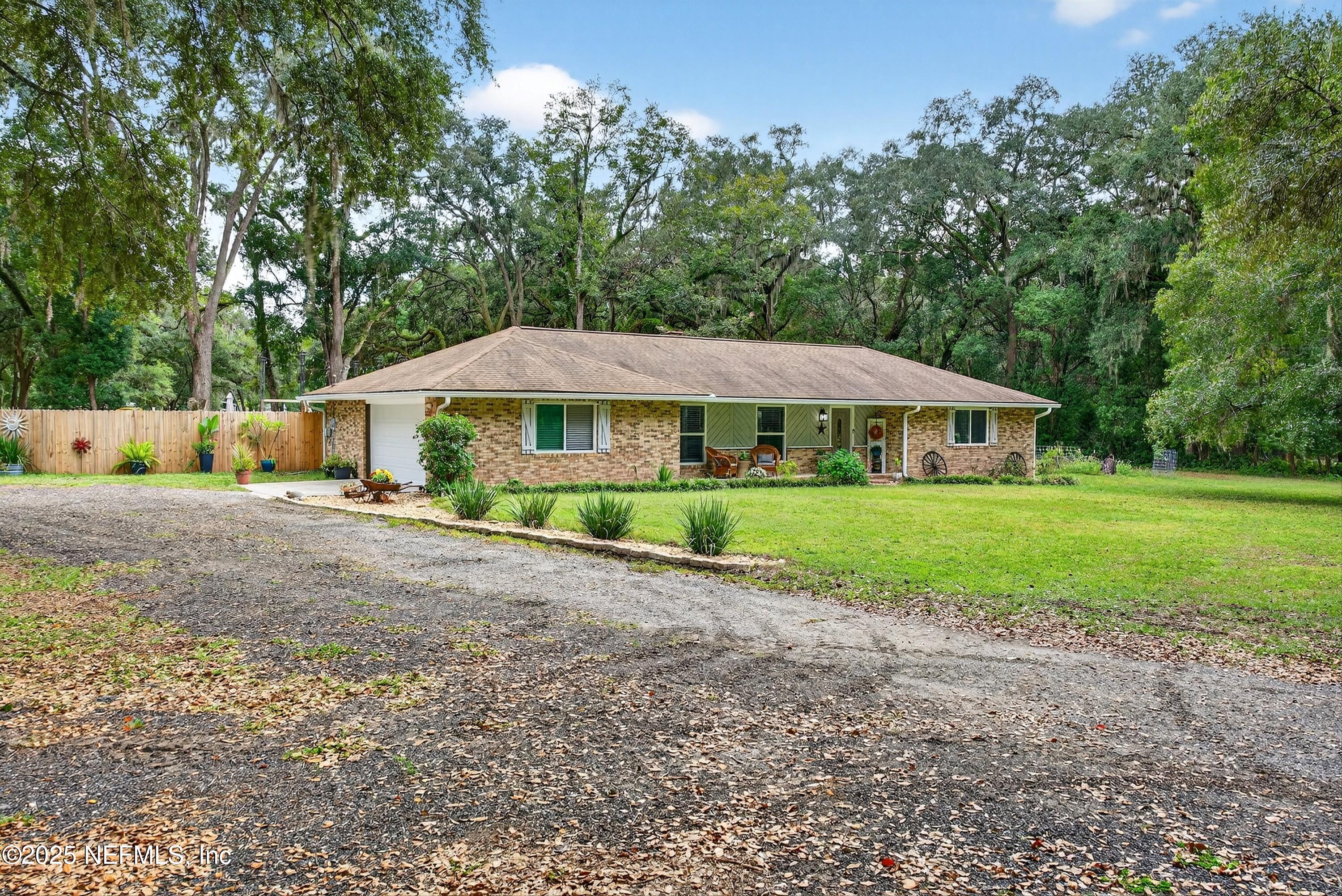 6049 Taylor Road Jacksonville, FL 32234 - Photo 14 of 60 a view of a house with a yard