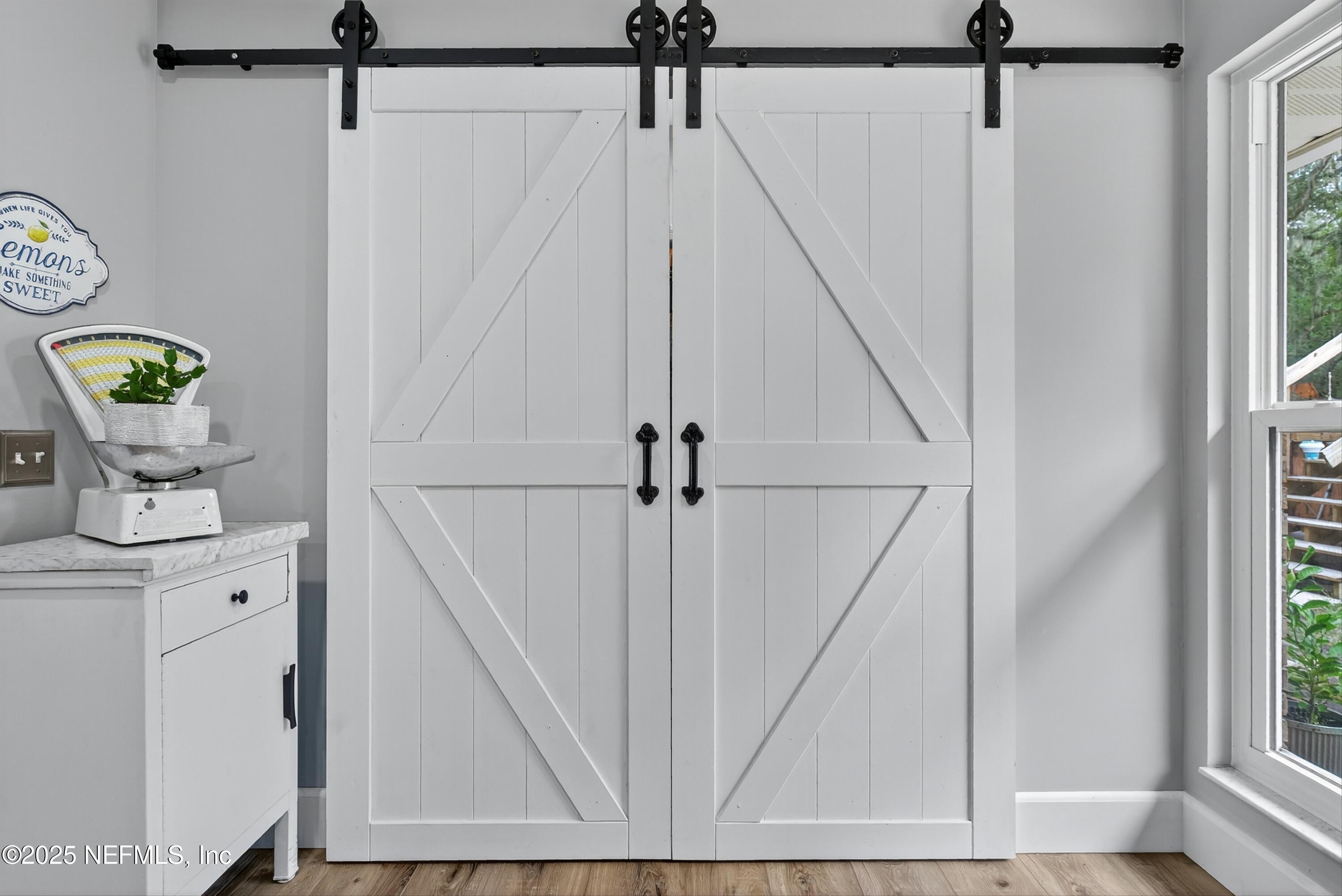 6049 Taylor Road Jacksonville, FL 32234 - Photo 25 of 60 a view of a hallway with wooden floor and entryway