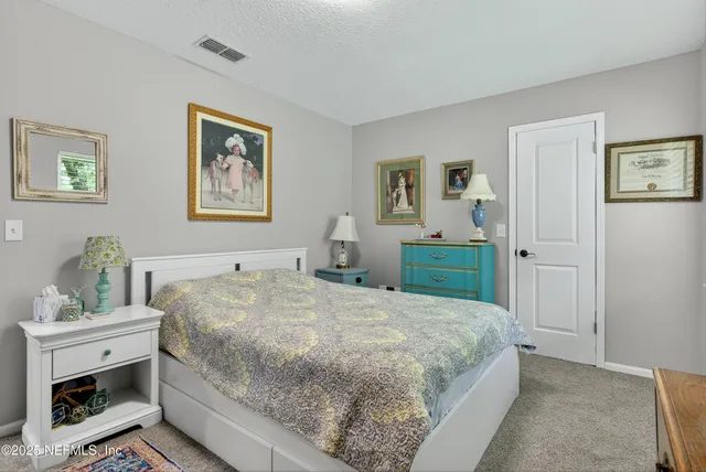 an aerial view of a house with outdoor space and sitting area