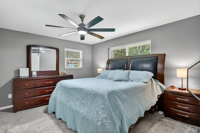 a view of a city with lush green forest