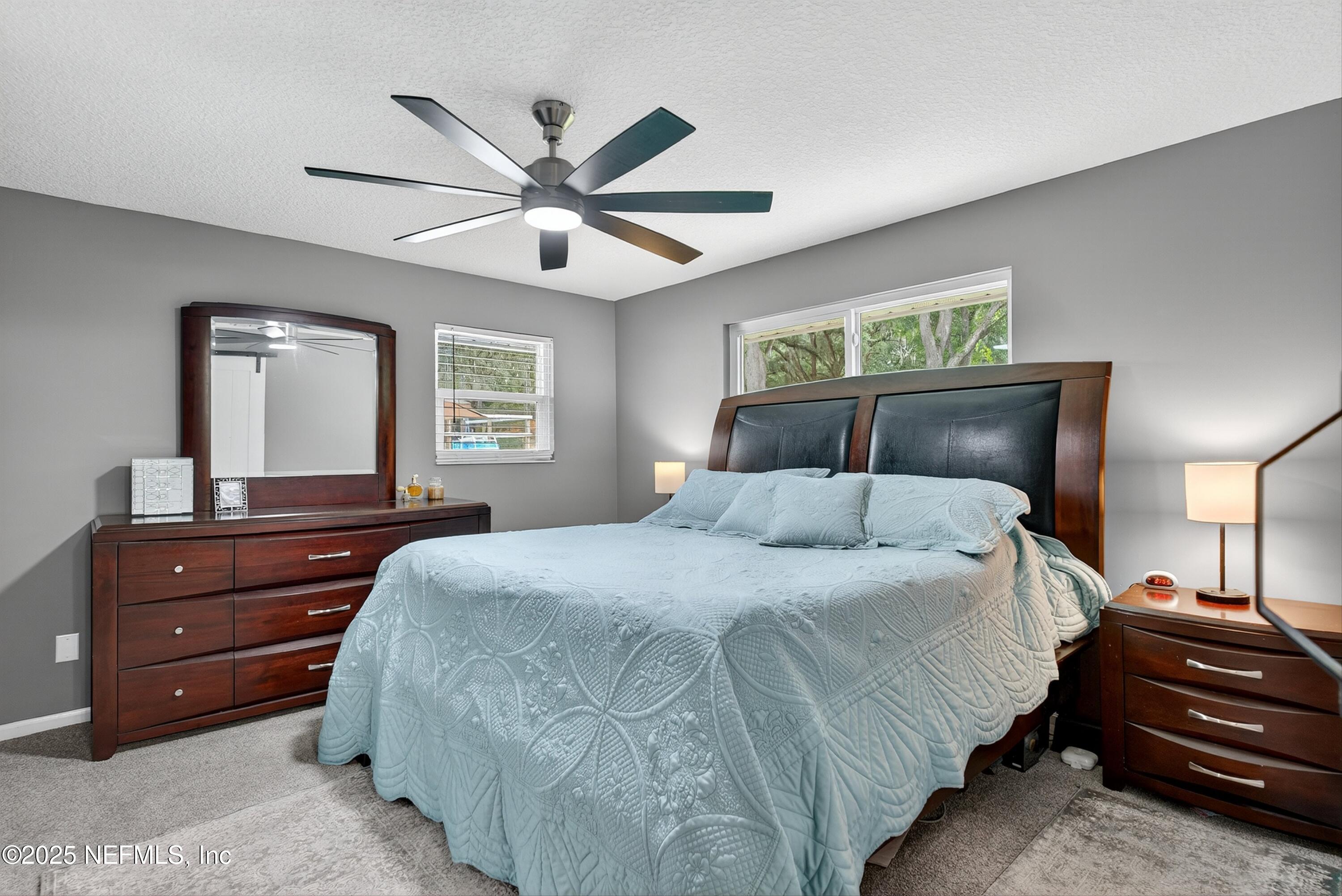 6049 Taylor Road Jacksonville, FL 32234 - Photo 36 of 60 a bedroom with a bed and a dresser