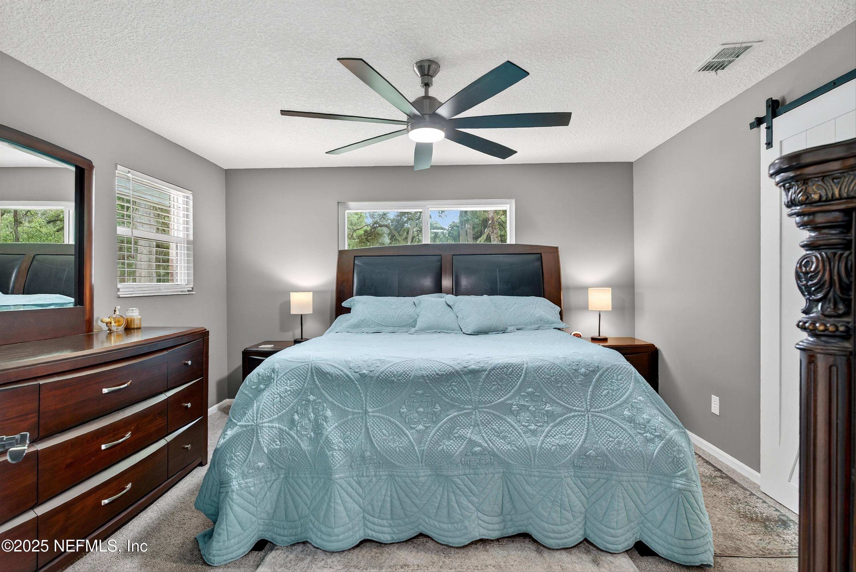 6049 Taylor Road Jacksonville, FL 32234 - Photo 37 of 60 a bedroom with a bed and window