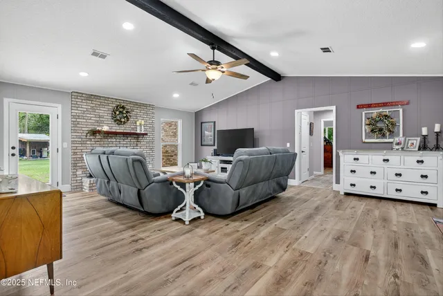 a view of livingroom with furniture and wooden floor