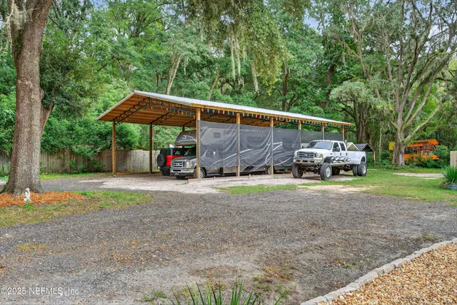 an aerial view of a house having yard table and chairs