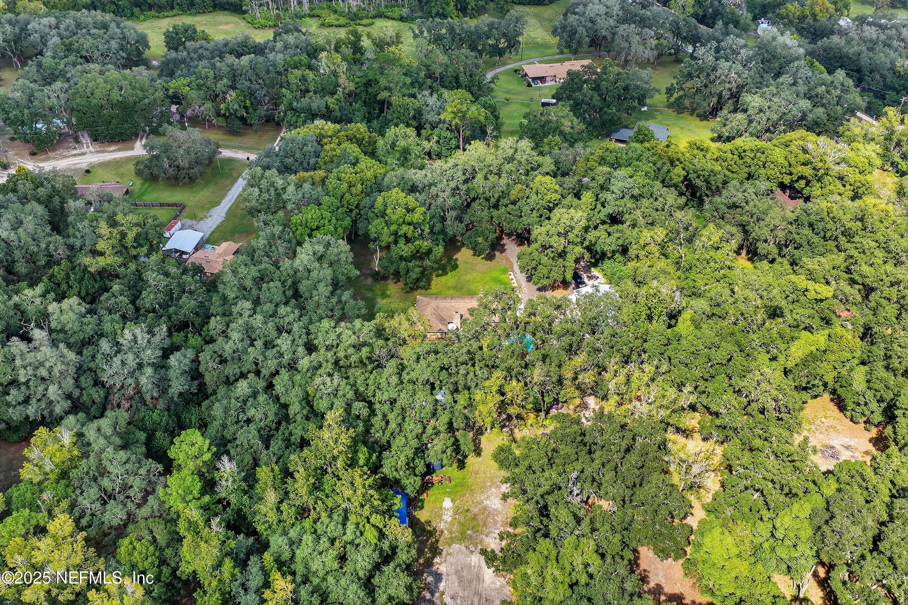 6049 Taylor Road Jacksonville, FL 32234 - Photo 57 of 60 an aerial view of residential house with outdoor space and trees all around