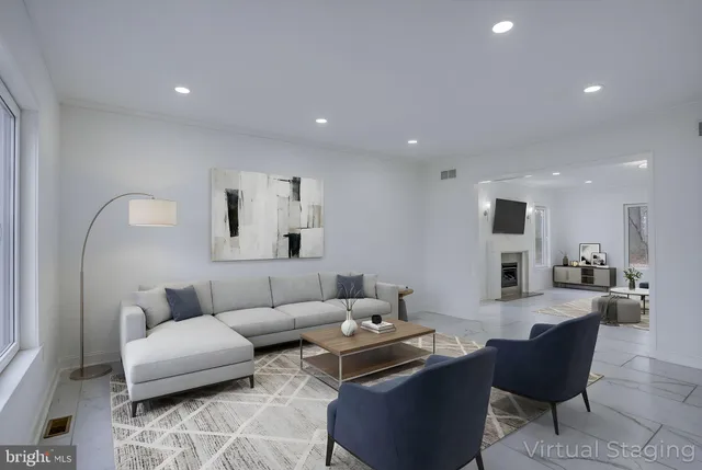 a spacious bedroom with a bed and a painting