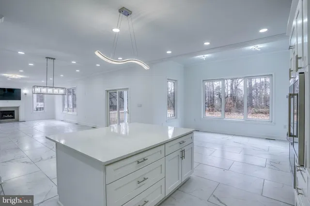 a kitchen with stainless steel appliances granite countertop a stove and a refrigerator