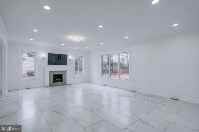 a view of a kitchen with a sink and a stove top oven