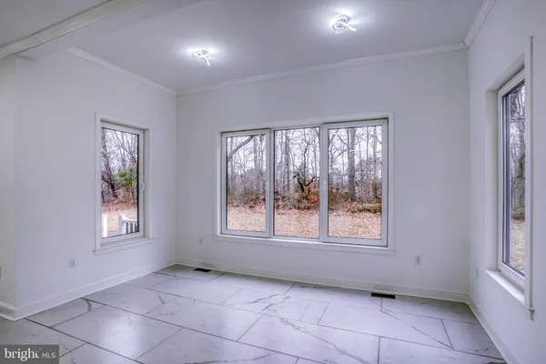 a bathroom with a sink a toilet a shower and a mirror