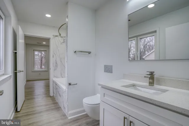 a view of an empty room and wooden floor