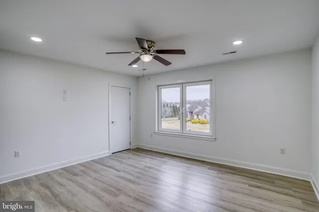 a view of a room with wooden walls
