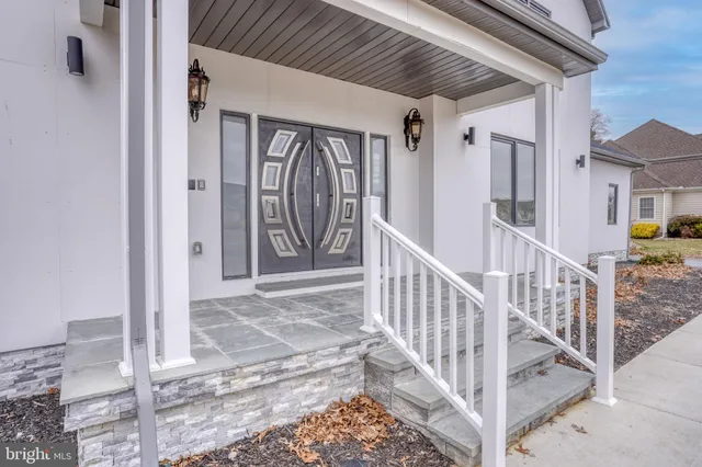 swimming pool view with two chairs