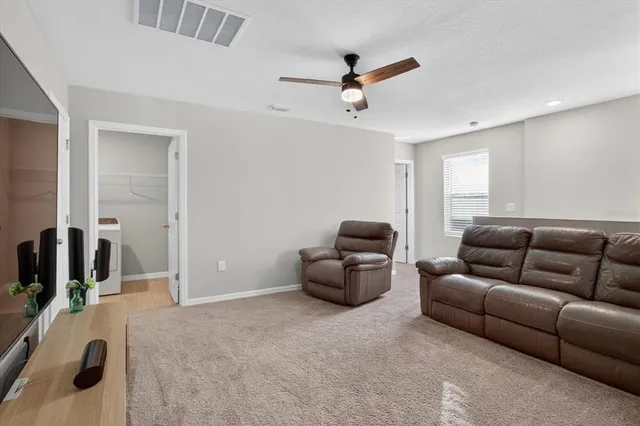 a bedroom with a bed and a cabinets