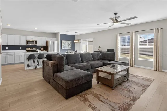 a living room with furniture and a window