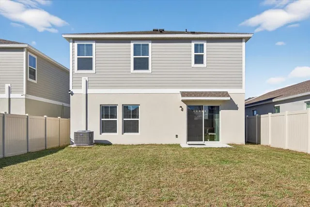 an aerial view of a house with a swimming pool