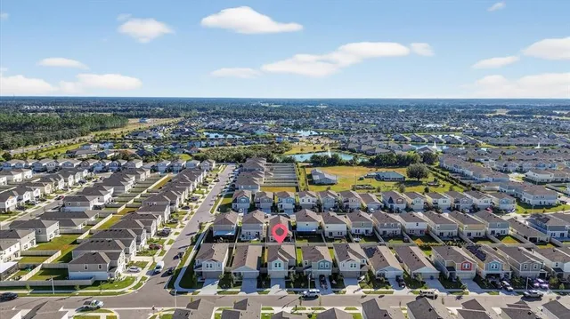 a view of a swimming pool with outdoor seating and lake view