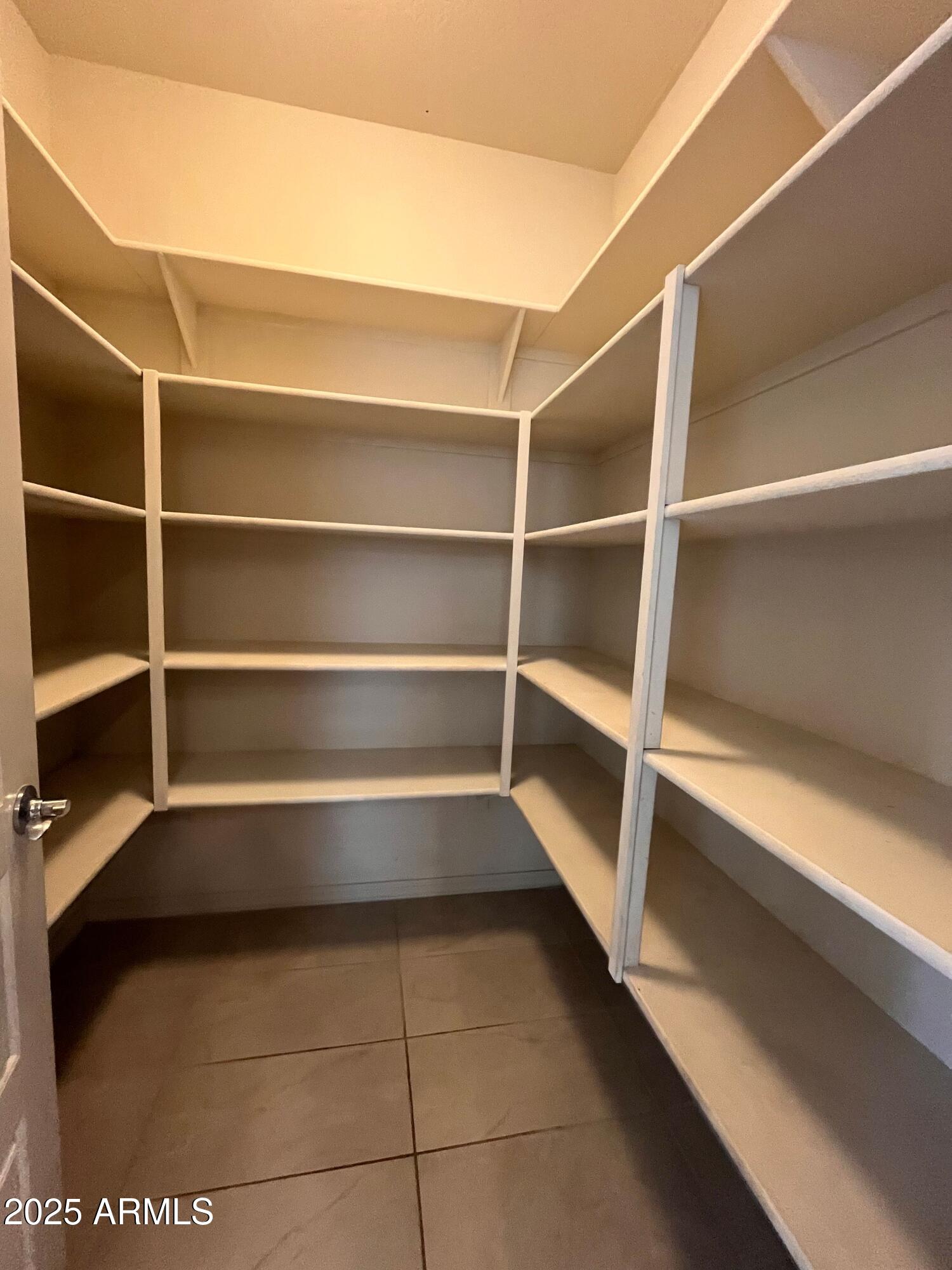 22857 East Marsh Road Queen Creek, AZ 85142 - Photo 18 of 38 a view of walk in closet with empty racks