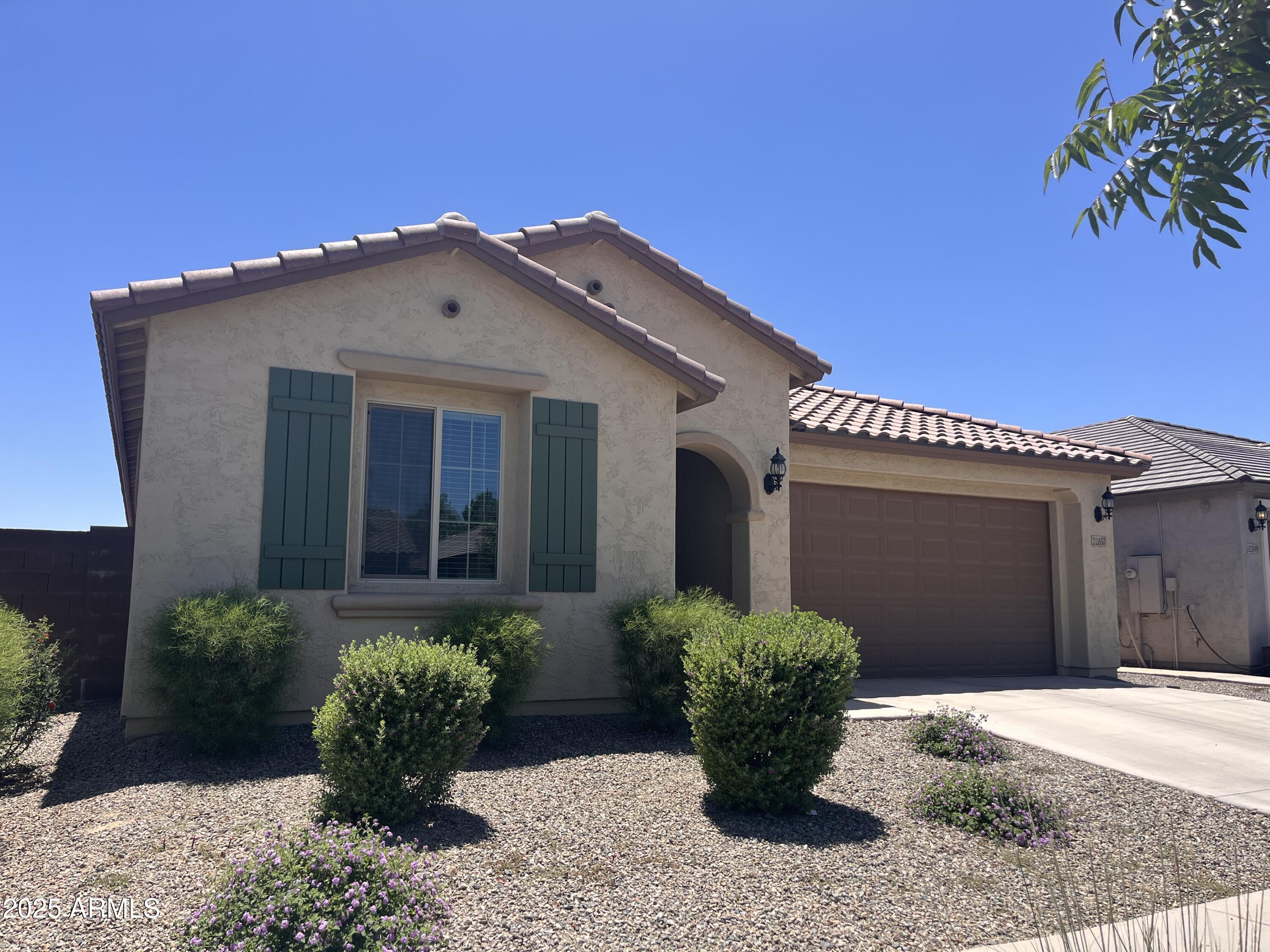 22857 East Marsh Road Queen Creek, AZ 85142 - Photo 2 of 38 a front view of a house with a yard