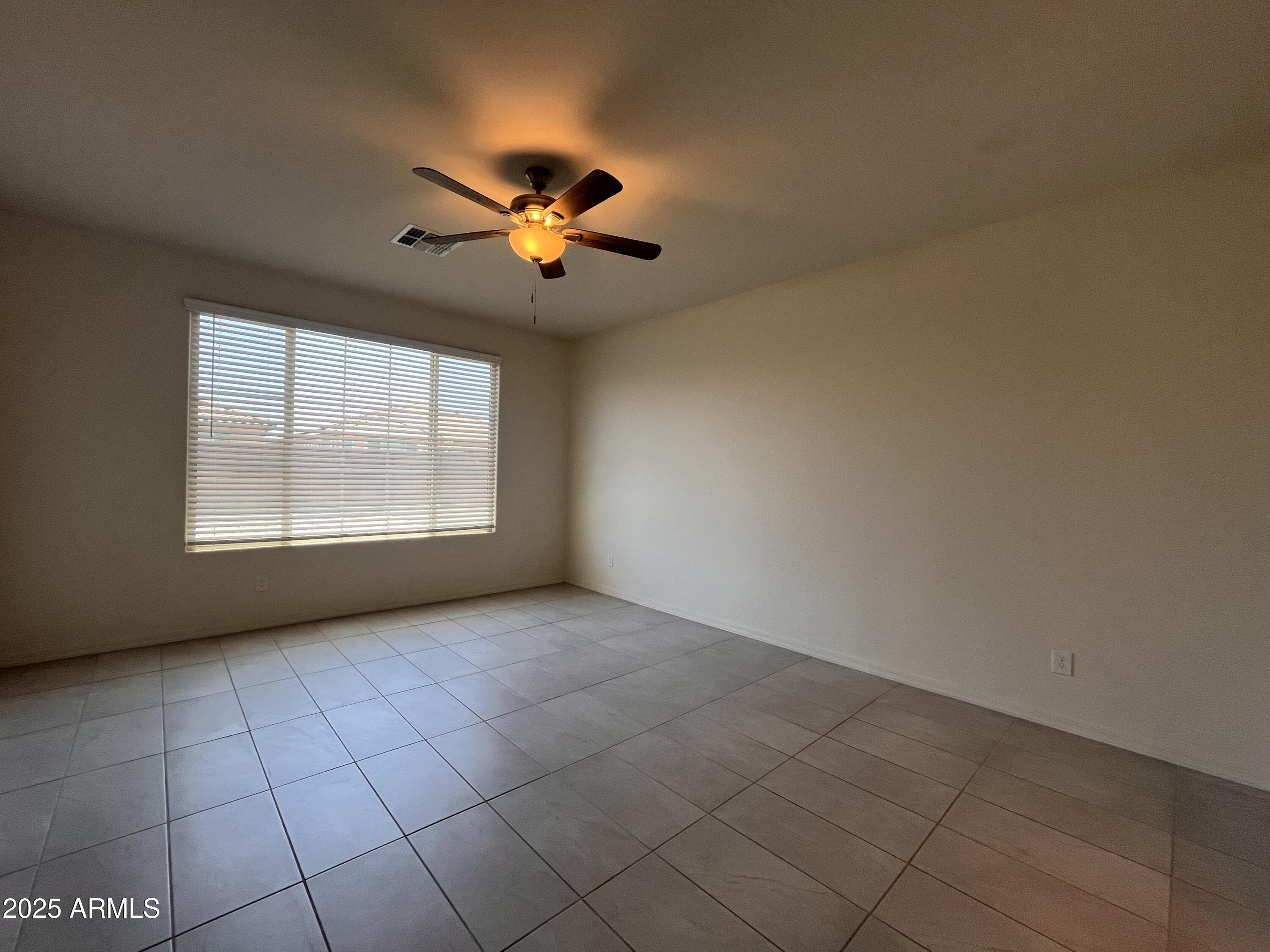 22857 East Marsh Road Queen Creek, AZ 85142 - Photo 22 of 38 an empty room with windows and chandelier fan