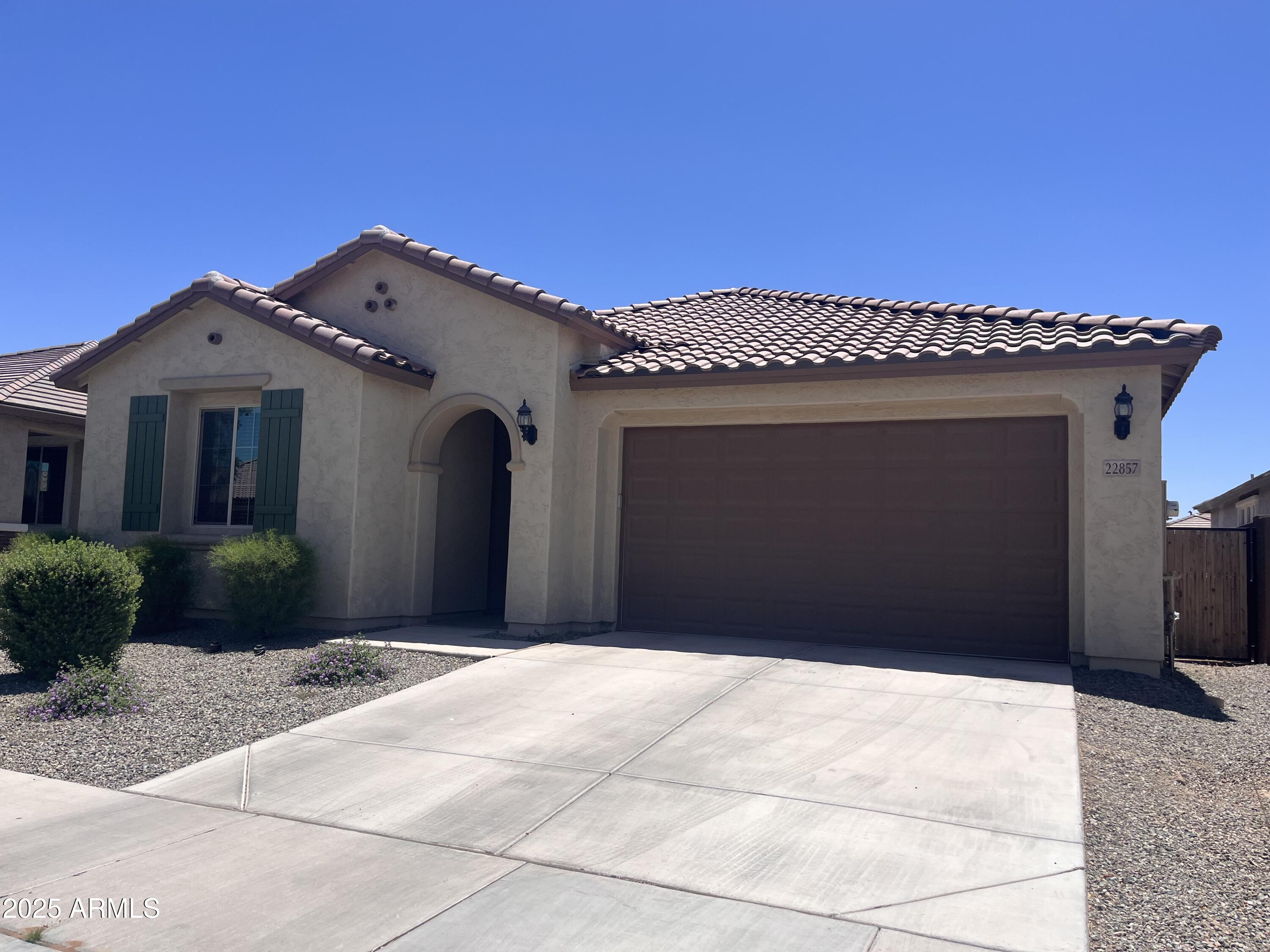22857 East Marsh Road Queen Creek, AZ 85142 - Photo 3 of 38 a front view of a house