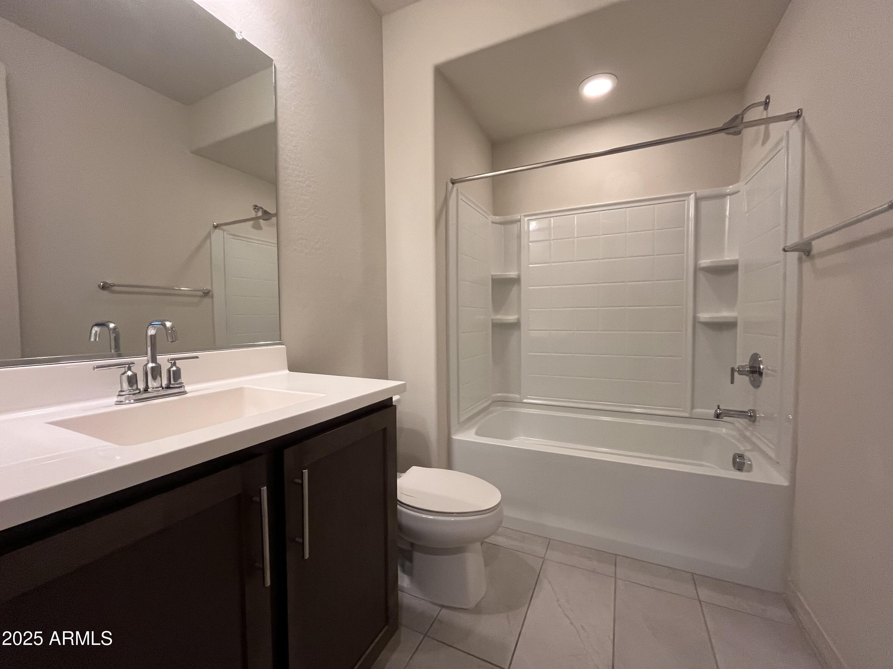 22857 East Marsh Road Queen Creek, AZ 85142 - Photo 34 of 38 a bathroom with a sink a toilet and shower