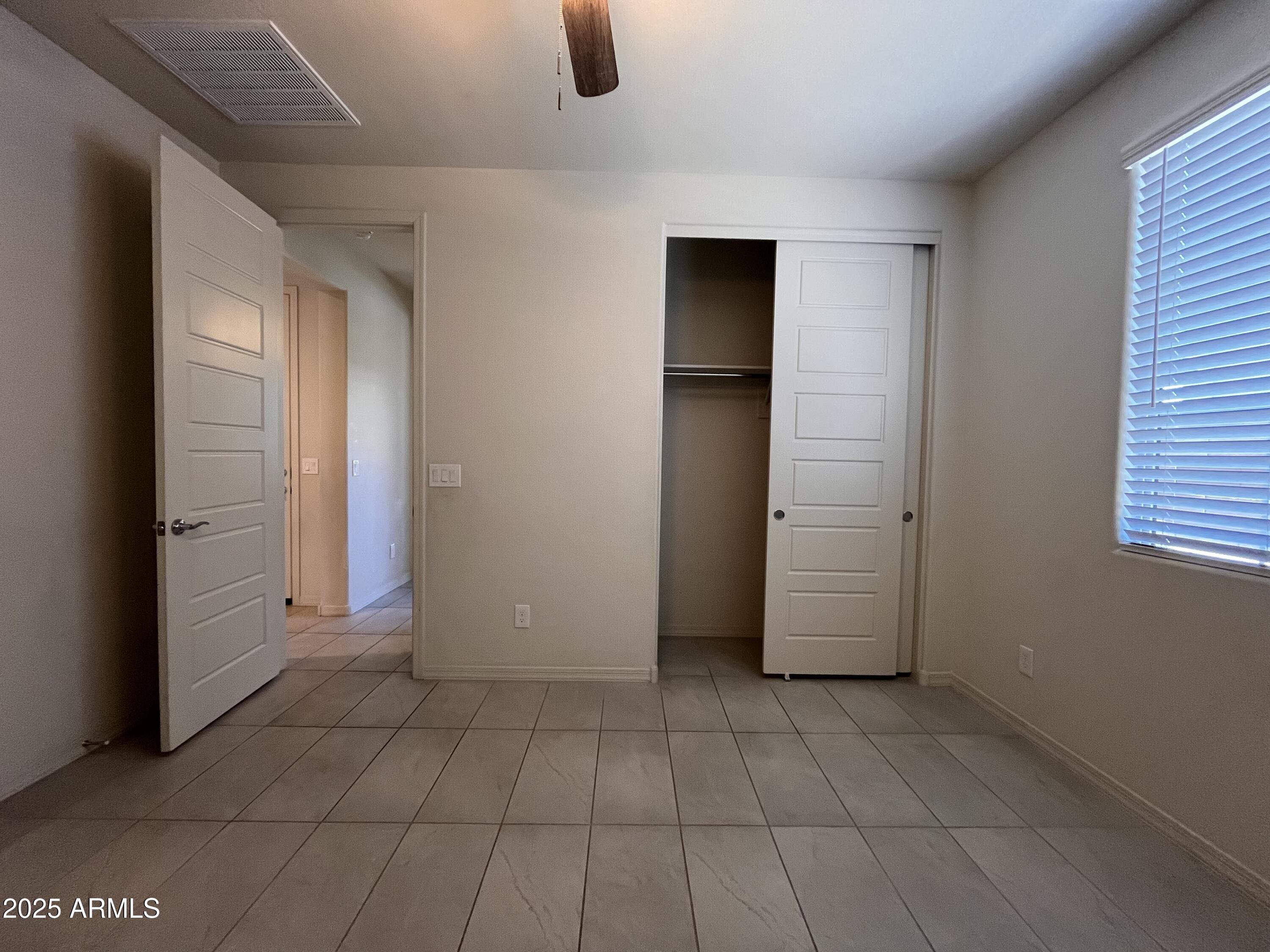 22857 East Marsh Road Queen Creek, AZ 85142 - Photo 6 of 38 an empty room with windows