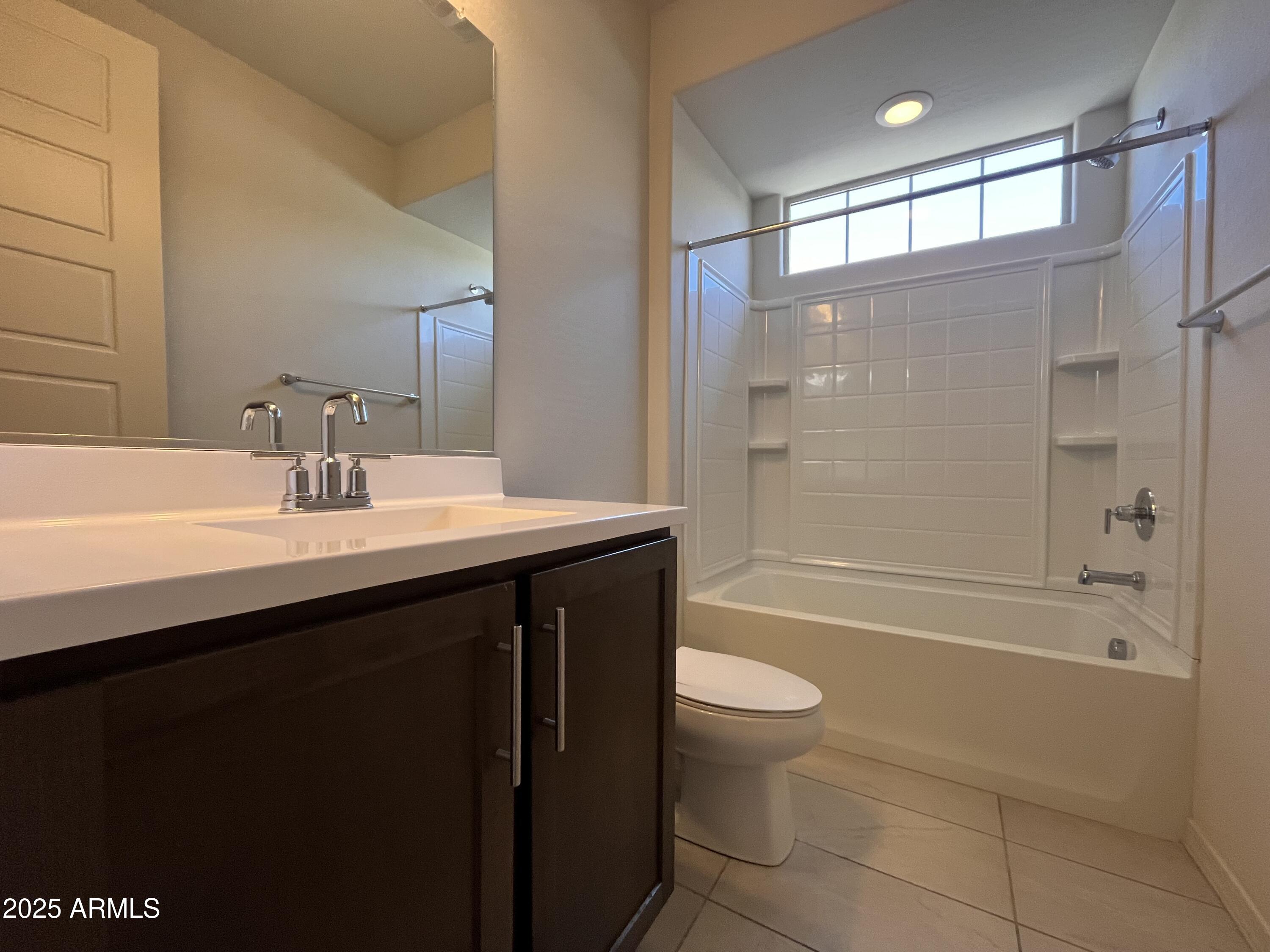 22857 East Marsh Road Queen Creek, AZ 85142 - Photo 7 of 38 a bathroom with a sink a toilet and shower