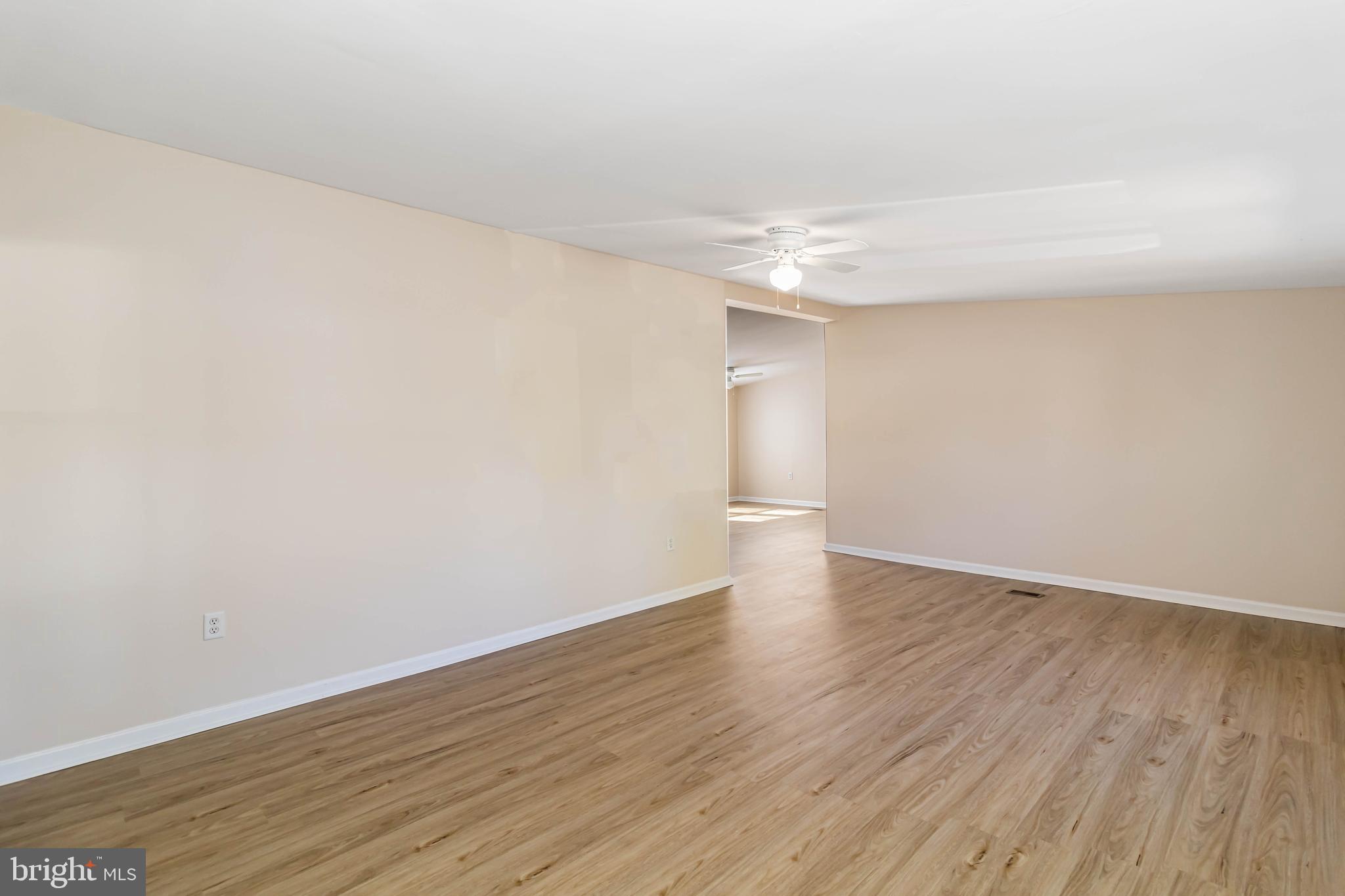 24 Welch Drive Dover, DE 19901 - Photo 3 of 39 a view of an empty room with wooden floor